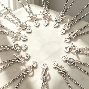 Silver initial heart pendant necklace with toggle clasp, stylish fashion clavicle chain detail.