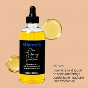 Detailansicht der 100ml GleamXi Haarverdickungslösung Flasche mit Pipette und Öl Tropfen.