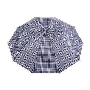 Detail view of a stylish plaid folding umbrella, featuring a durable 10-rib construction.