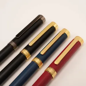 Close-up detail of metal rollerball pens in multiple colors with smooth grip for office writing.