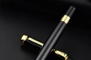 Luxury black and gold rollerball pen with metal barrel and heavy hand feel for business.
