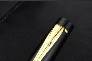 Detail view of luxury black and gold metal signature pen with elegant engraved clip.
