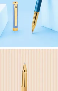 Metallic rollerball pen detail shot featuring golden nib and morandi blue cap design.