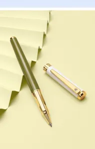 Close-up shot of the metallic rollerball pen showcasing its olive green body and gold trim.