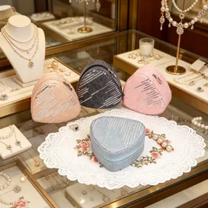 Detail view of heart-shaped denim jewelry organizers featuring silver sequin stripes