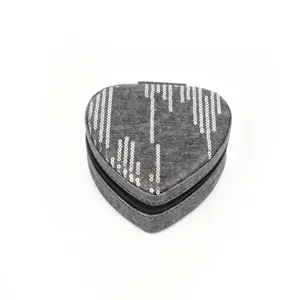 Heart-shaped grey denim jewelry box with decorative silver sequin stripes and zipper