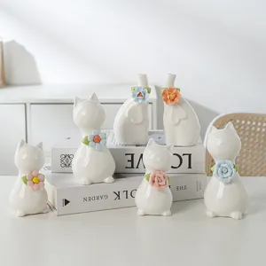 Handmade ceramic animal figurines, cute cat and elephant desktop ornaments for home decor.