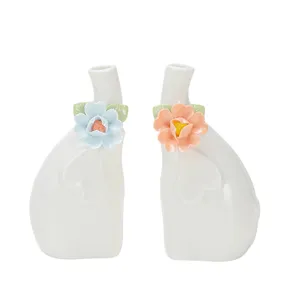 Handmade ceramic elephant flower ornament pair, cute white animal desktop decor for home.