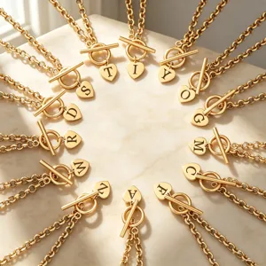 Gold letter heart pendant toggle clasp necklace detail close-up showcasing fashion style.