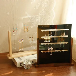Detail view of wooden jewelry display stands showing earring organizational slots