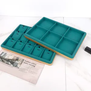 Emerald green velvet jewelry display trays with gold frames for necklace and pendants