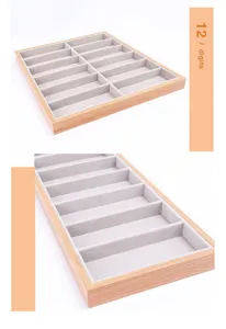 Detaillierte Makroansicht der Brillenschale aus Holz mit 12 Fächern und grauem Samtfutter