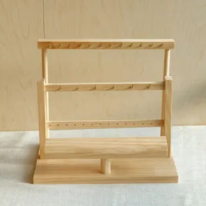 Solid wood tiered jewelry display stand with metal hooks and horizontal bracelet bar