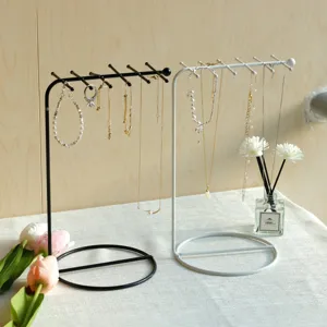 Minimalist iron jewelry display stand organizer for necklaces and bracelets on table