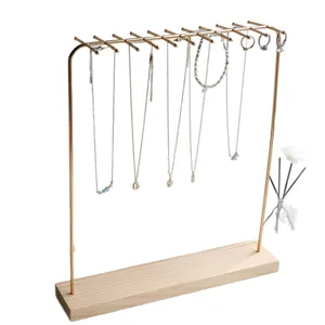 Solid wood jewelry display stand with gold metal hooks for necklaces and bracelets