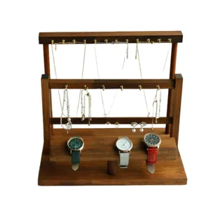 Walnut wood jewelry display stand with hooks for necklaces and watch storage tier.