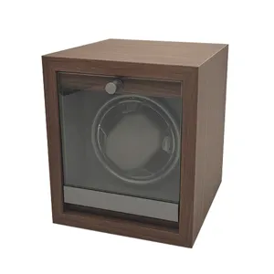 Close-up view of a wooden automatic watch winder with dark walnut grain finish.