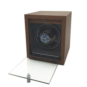 Detail shot of the black walnut wood automatic watch winder with open glass door