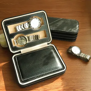 Detailed view of a vintage black leather watch case with soft beige interior lining.