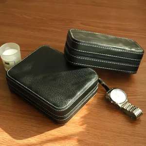 Retro black leather watch boxes with white stitching and zipper closure details