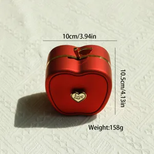 Detail showing red apple-shaped jewelry gift box dimensions and weight specifications