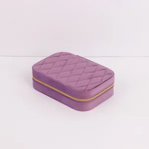 Portable purple velvet jewelry travel box with quilted diamond pattern and gold zipper