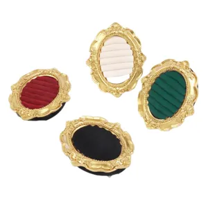 Four vintage gold resin jewelry display frames with velvet slots for rings and earrings.