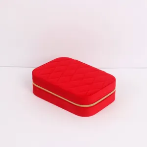 Detailed view of a red quilted velvet portable travel jewelry storage organizer box
