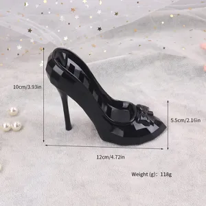 Elegant black high heel jewelry organizer with faceted design and slots for rings