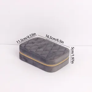 Compact grey quilted velvet travel jewelry case with 16.5x11.5x5cm size markings