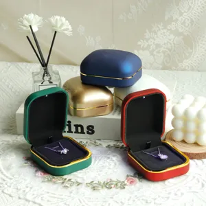 Collection of premium LED-lit jewelry boxes in various colors for elegant necklaces