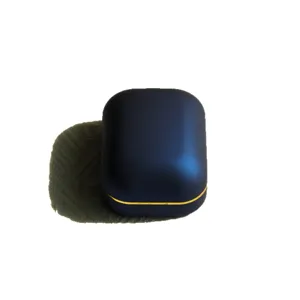 Luxurious navy blue matte LED ring box with elegant gold trim for wedding proposals