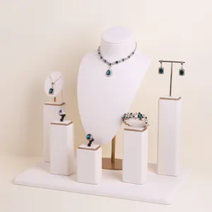 Cream microfiber jewelry display set featuring bust, earring stand, and ring pedestals.