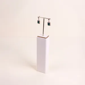 Detailed view of premium cream microfiber jewelry stand featuring a golden T-bar display