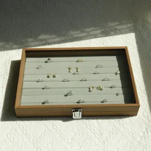 Large walnut grain jewelry display box with grey velvet lining for rings and earrings