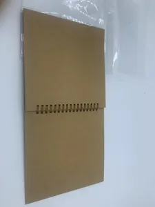 Blank kraft paper DIY scrapbook photo album with spiral binding for handmade memories gifts.