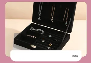 Detailed view of the large capacity black velvet jewelry box featuring necklace hooks