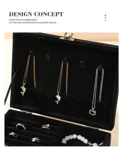 Close-up view showing necklace hooks and ring storage slots in a premium black velvet jewelry box