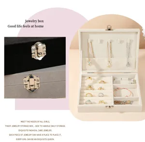 Detail showing various compartments and necklace hooks in this velvet jewelry storage box.