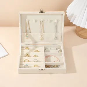 Elegant cream velvet jewelry box with multi-compartments for rings and necklaces