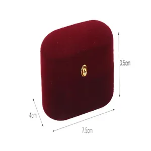 Detail view of red velvet oval jewelry storage box with dimensions 7.5cm x 4cm x 3.5cm
