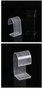 Detail view of transparent acrylic earring display stands in textured and clear styles