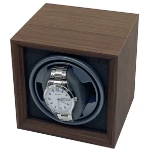 Detailed view of a walnut wood automatic watch winder box with a silver watch