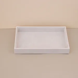 Detail view of a premium light gray velvet jewelry organizer tray for rings and necklaces