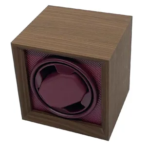 Detailed view of vintage walnut wood automatic watch winder with burgundy interior