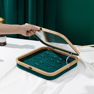 Bamboo jewelry storage box with glass lid and green velvet ring display tray
