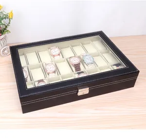 Detail view of a 24-slot black leather watch box with clear window and velvet lining
