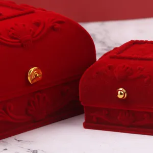 Luxury red flocked velvet jewelry boxes with embossed floral patterns for wedding gift.