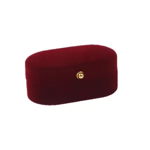 Vintage burgundy velvet jewelry box for rings and earrings with gold button detail