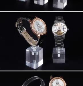 Detail of high-end transparent acrylic watch display blocks on black background